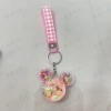 Mickey Mouse head oil keychain, exquisite and cute, sand floating bottle, schoolbag pendant, decoration, car key pendant Application Scenario